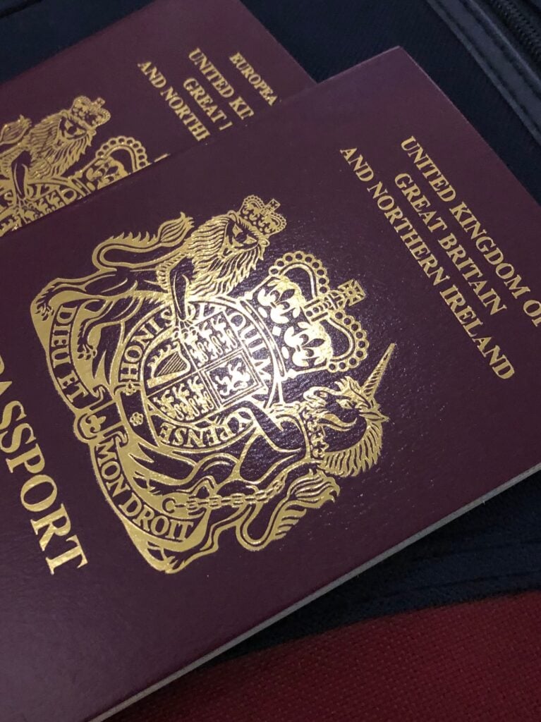 Two official British passports ready for summer vacation and holiday abroad