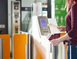 Passenger Safely Checking Passport at Automated Gate at the Airport - Traveling Documents